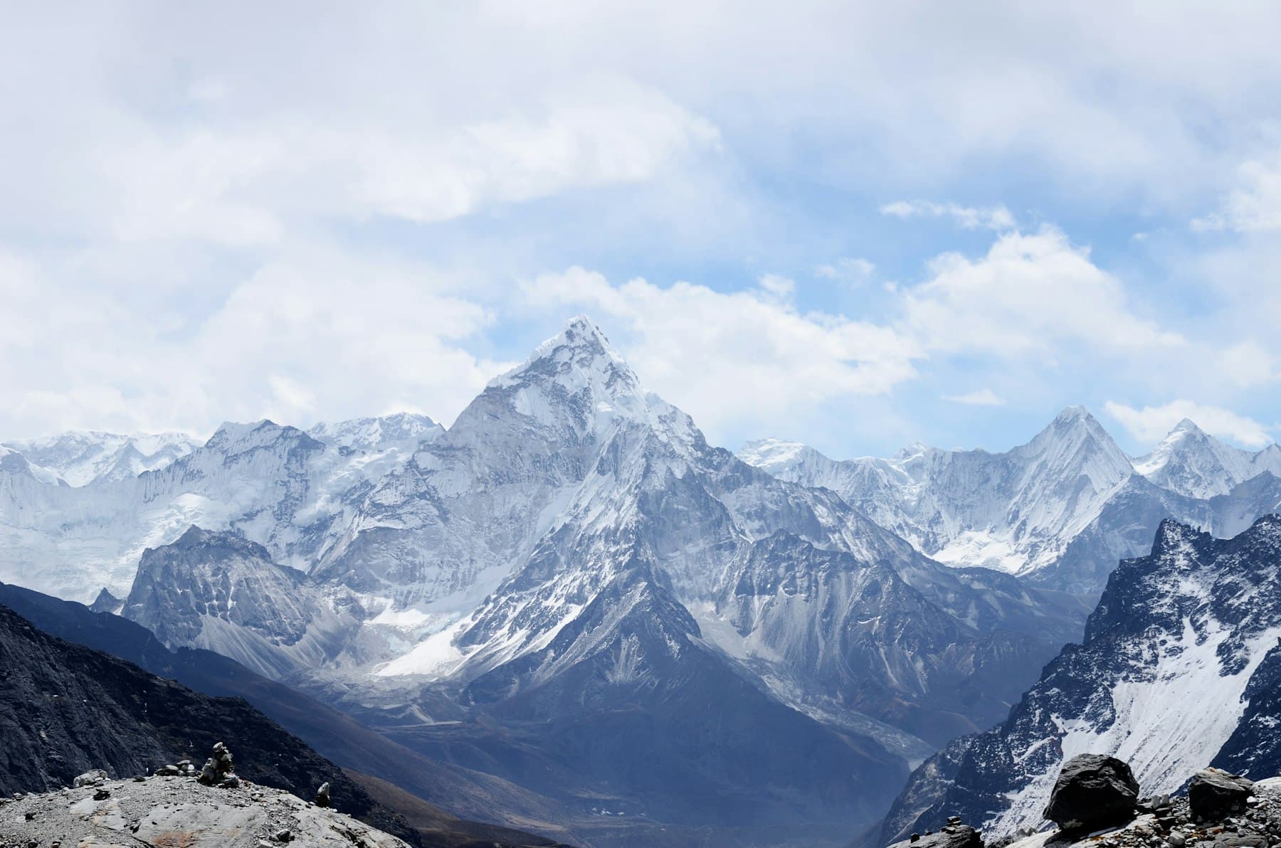 A remote snow ridge and rocky plateau under a pale sky, typical of the high interior